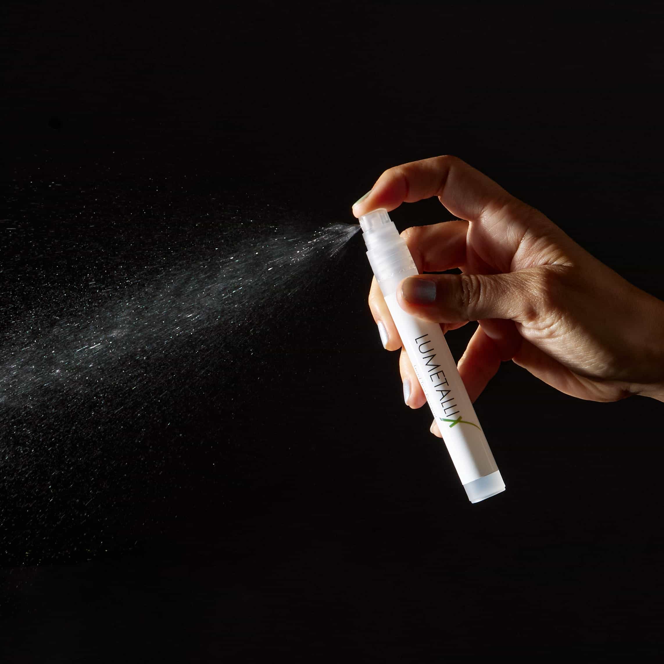 A Reagent spray bottle spraying from the right