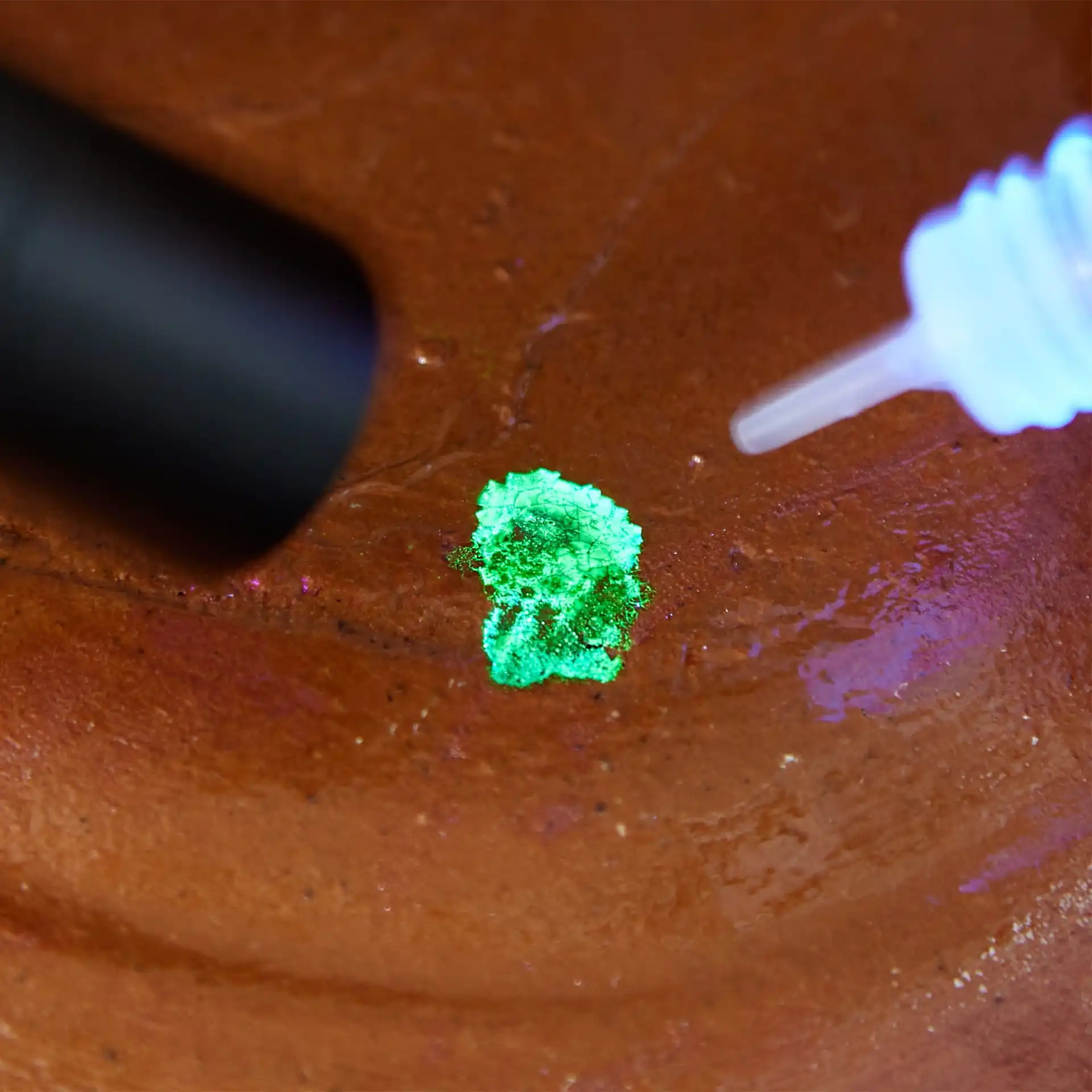 A close up view of a drop Reagent on a ceramic bowl